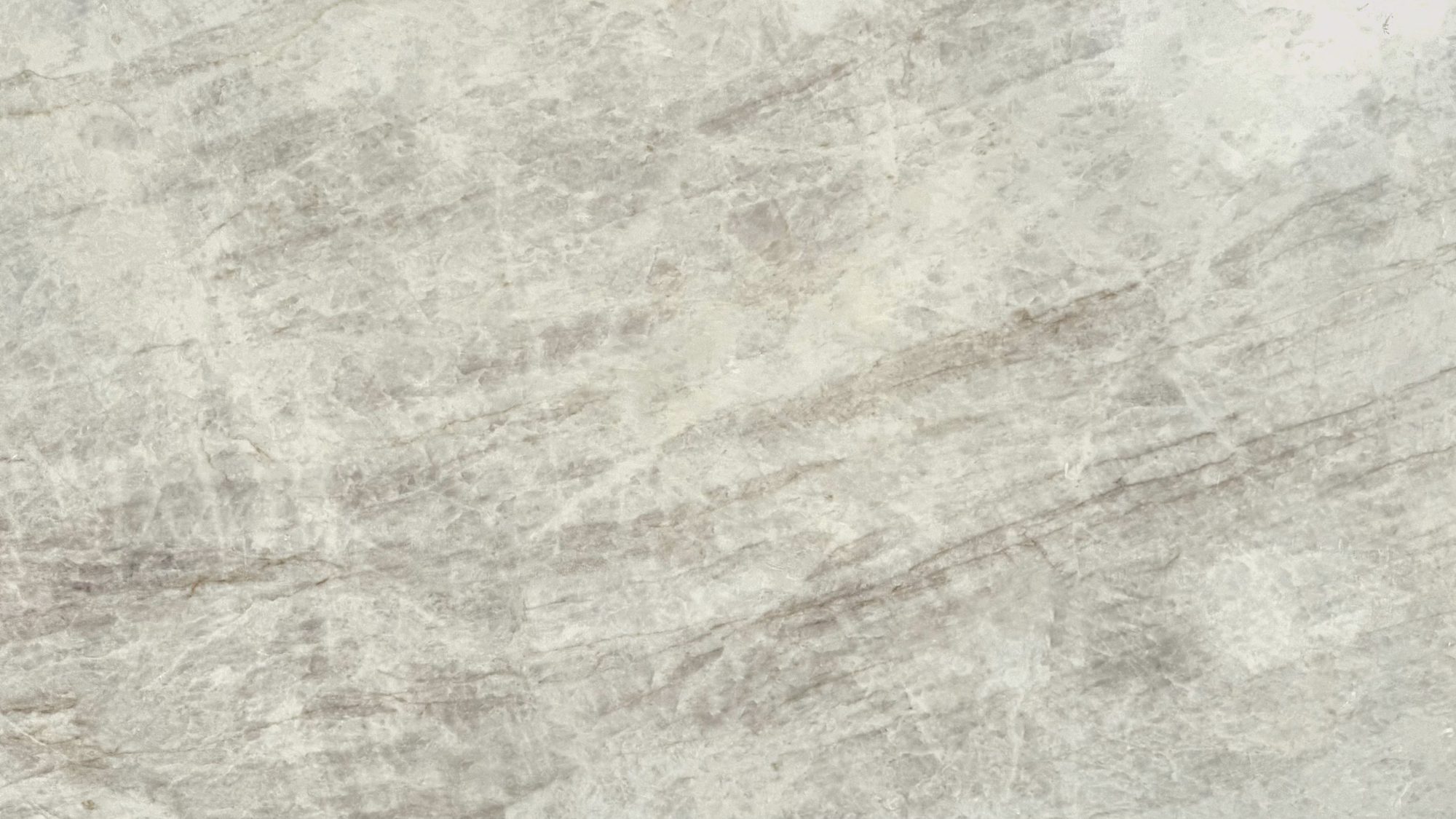 Natural stone slab with soft gray and pink veining
