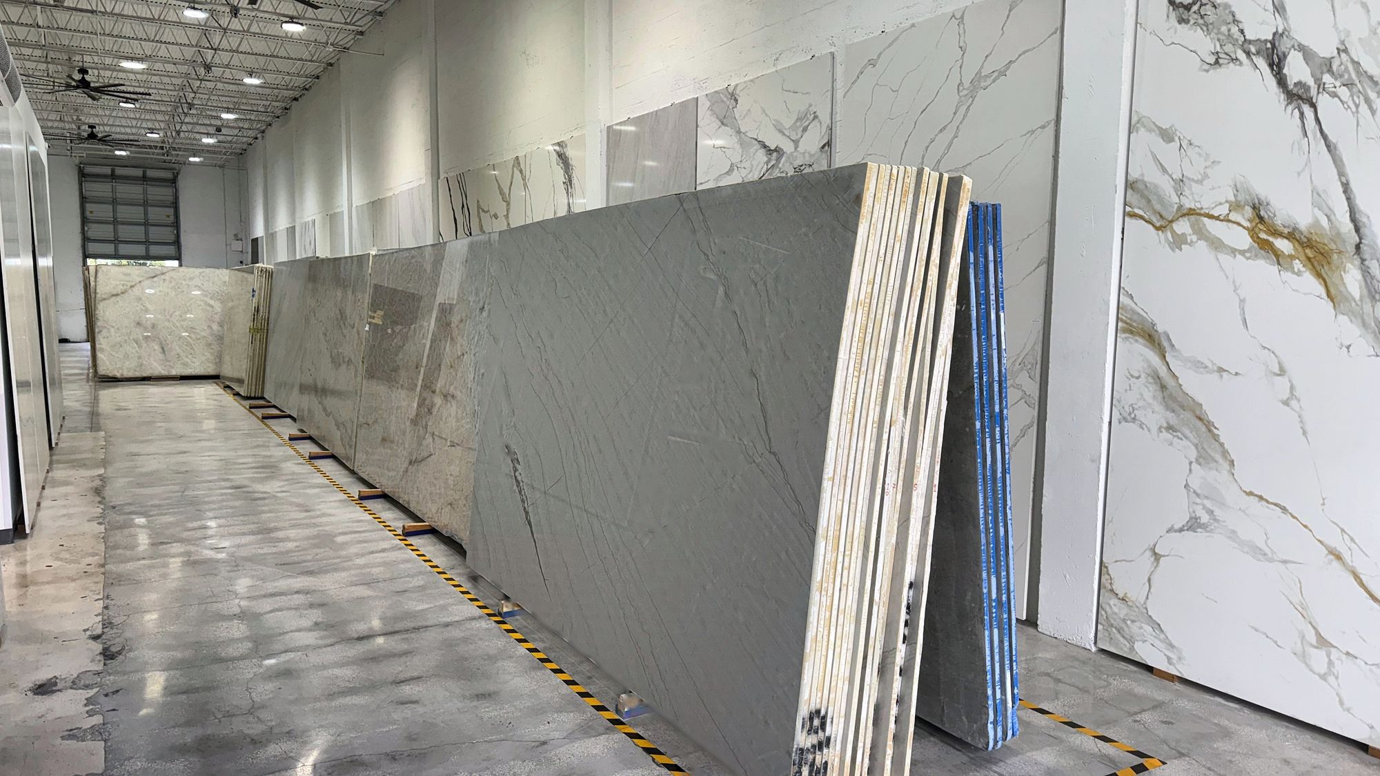 Gray quartzite slabs on display in the All Stones FL showroom